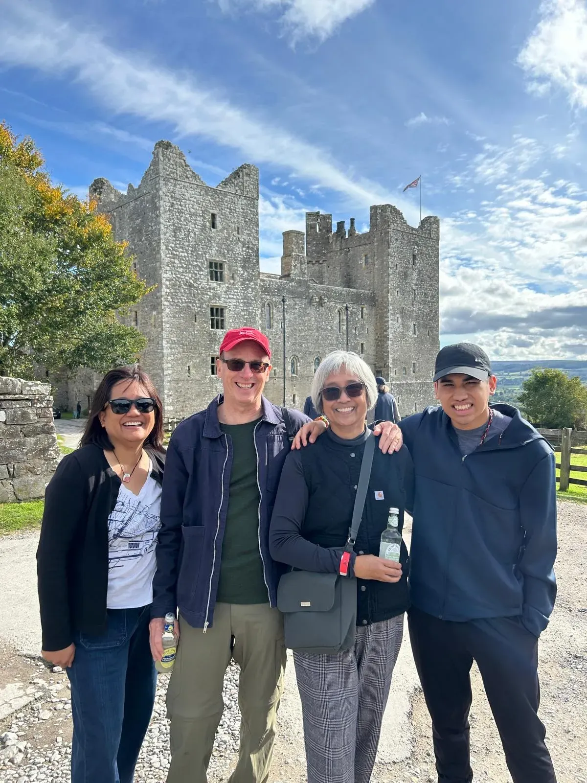A family group at Bolton Castle in the Yorkshire Dales on a private York to Edinburgh transfer tour